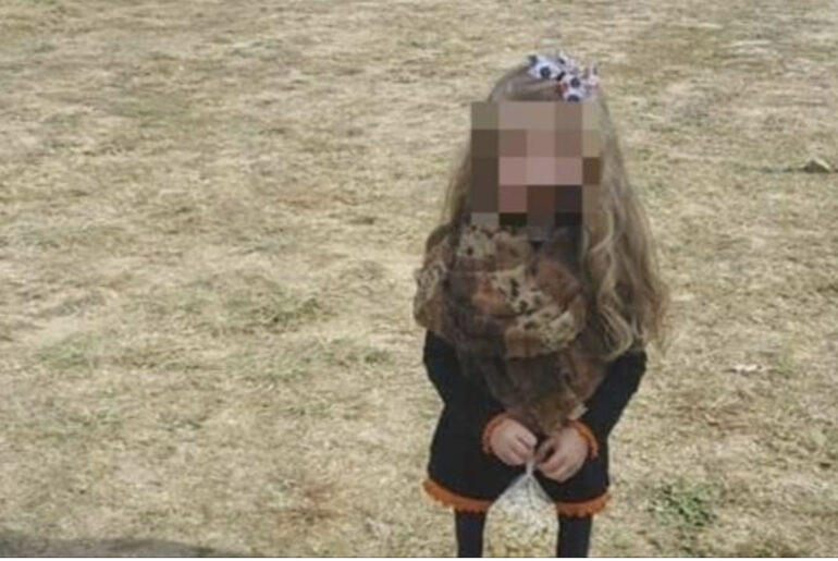 Picture of little girl holding bag of popcorn has broken the internet