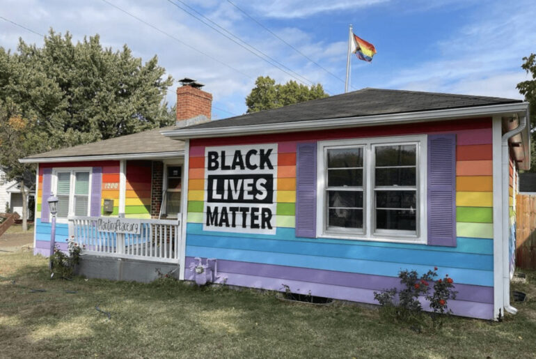 Man buys a home across from a homophobic church just to paint it the colors of the pride flag